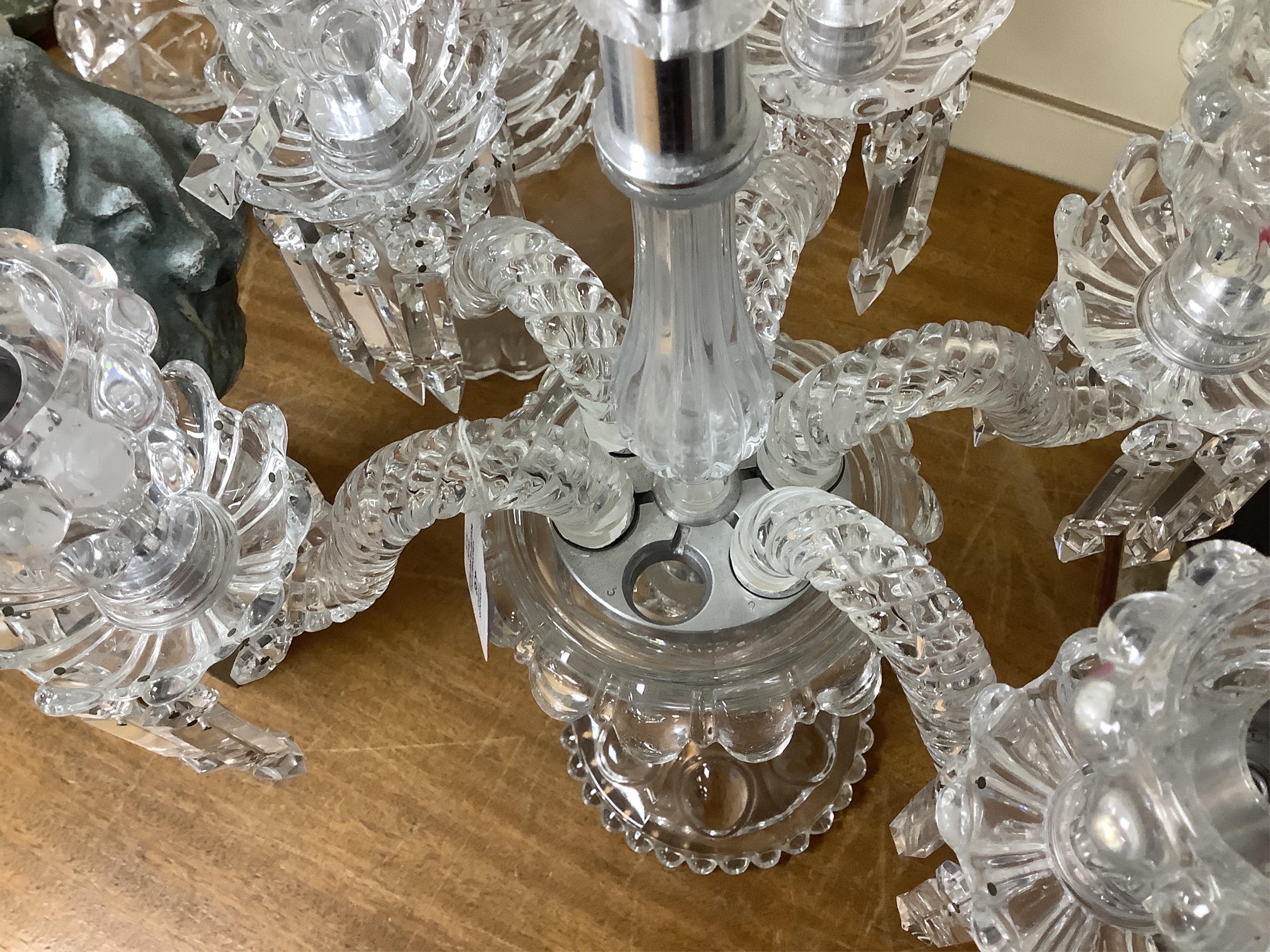 A Baccarat style moulded glass five branch candelabrum (lacking one arm), 58cm high. Condition - good, lacking one arm